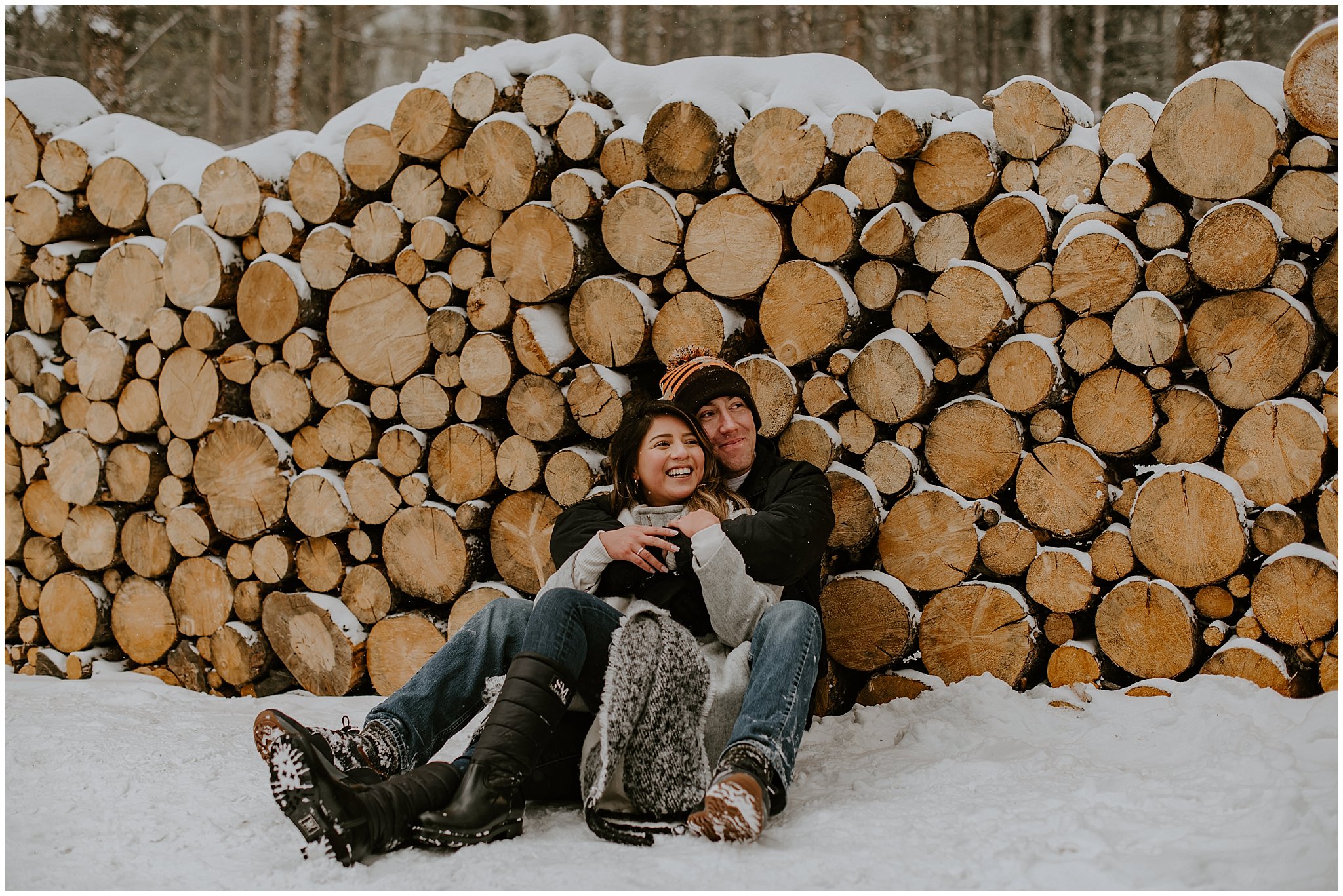 Newly engaged couple embraces in Breckenridge for portraits in the snow